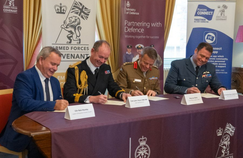 Hampshire County Council Leader Councillor Rob Humby signing the Armed Forces Covenant.