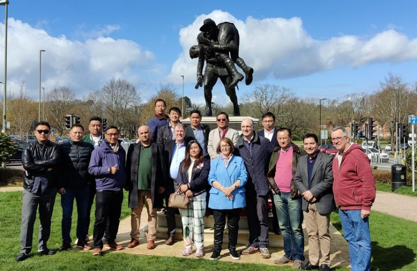 Leo pictured with members of the Nepali community by the Gurkha Memorial Statue in Princes Gardens, Aldershot