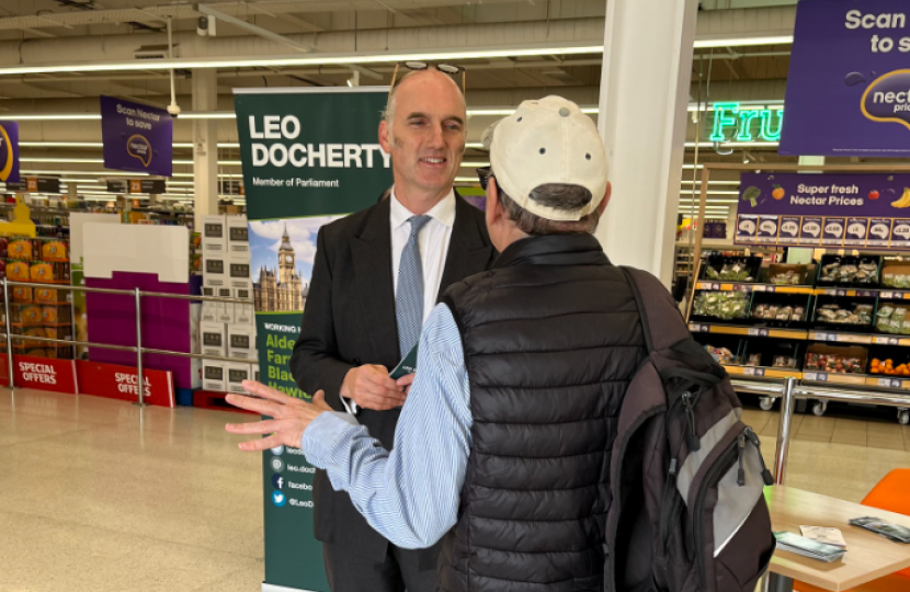 Leo Docherty MP speaking with a local resident in Sainsbury's, Farnborough