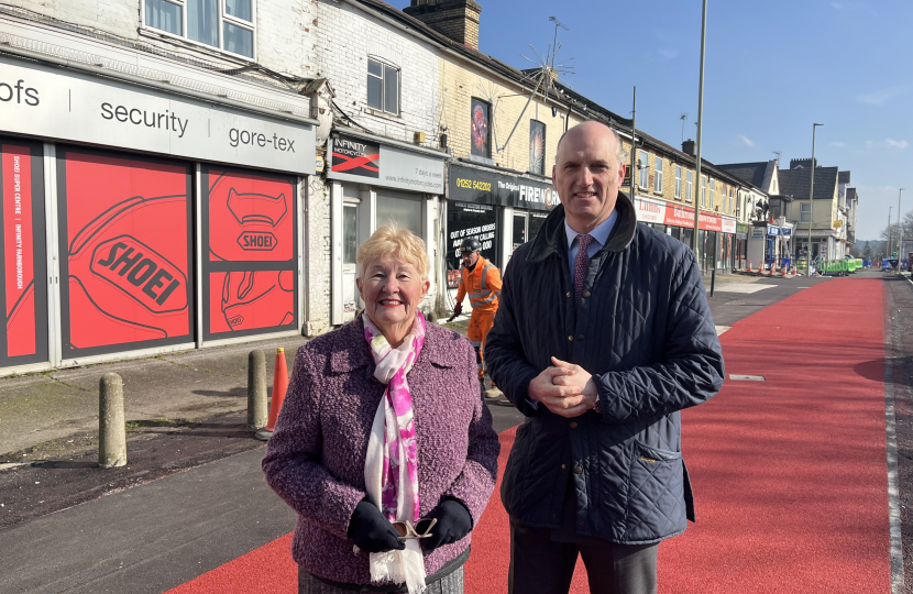 Leo and Cllr Diane Bedford outside the parade of shops on Lynchford Road, Farnborough