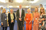 Leo Docherty with teachers and staff at the Wavell School