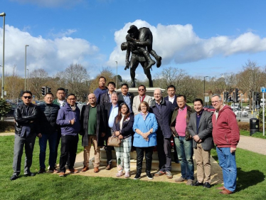 Leo pictured with members of the Nepali community by the Gurkha Memorial Statue in Princes Gardens, Aldershot