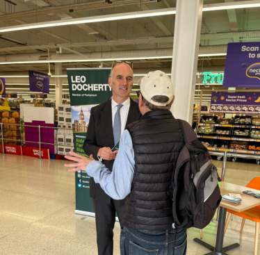Leo Docherty MP speaking with a local resident in Sainsbury's, Farnborough