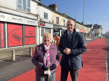 Leo and Cllr Diane Bedford outside the parade of shops on Lynchford Road, Farnborough